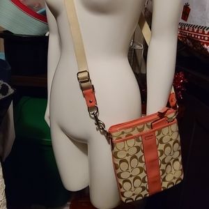 Coach crossbody with strap easement